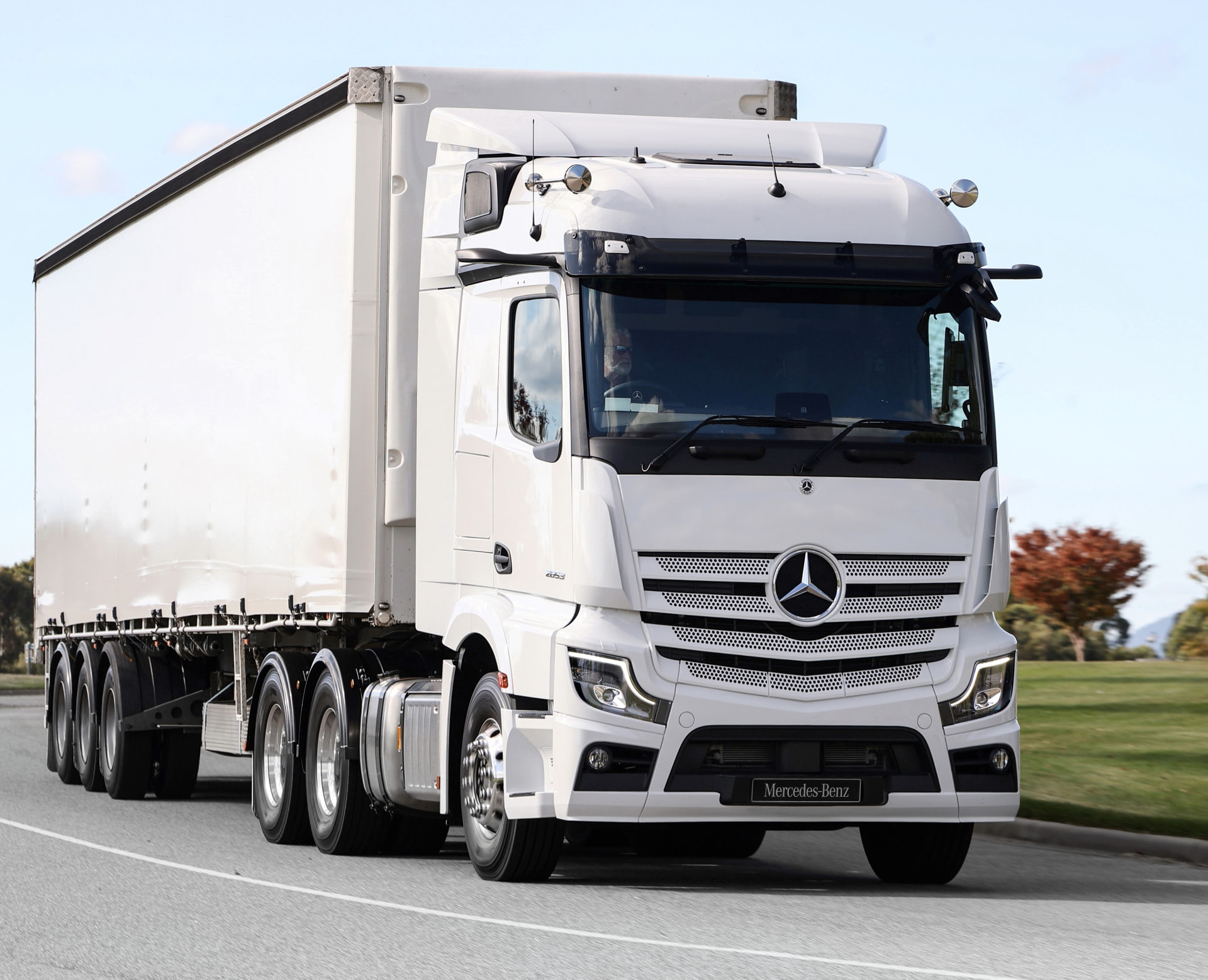 White Mercedes-Benz Actros prime mover on the road